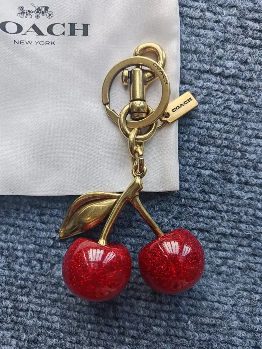 Coach Gold-Tone Cherry Key Charm with Red Glitter